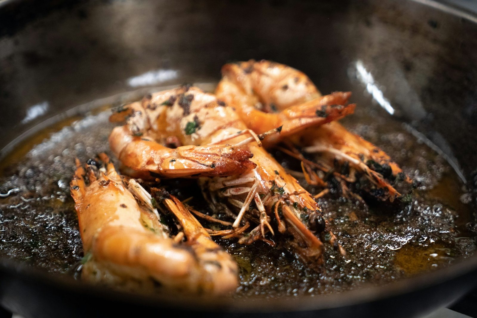 Cooked shrimp in a frying pan, illustrative photograph for chili-lime butter shrimp recipe